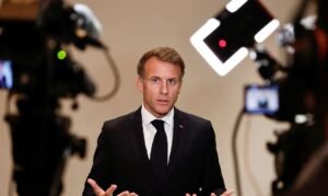 French President Emmanuel Macron gestures as he speaks to members of the media on the day of the 9th Annual One Planet Sovereign Wealth Funds (OPSWF) Summit, in Lusail, Qatar, October 21, 2026. REUTERS/Benoit Tessier/Pool TPX IMAGES OF THE DAY